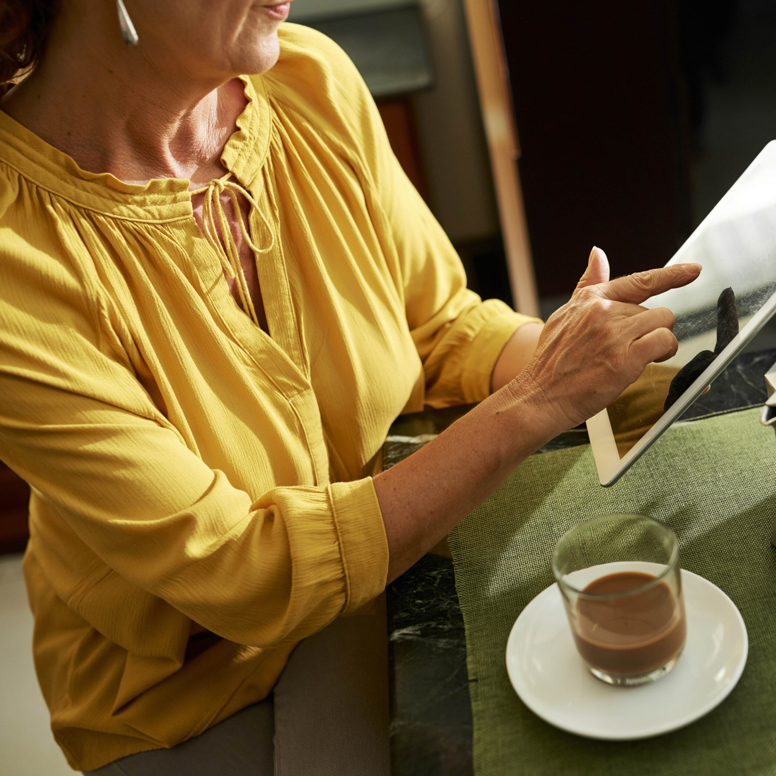 woman-checking-tablet-square