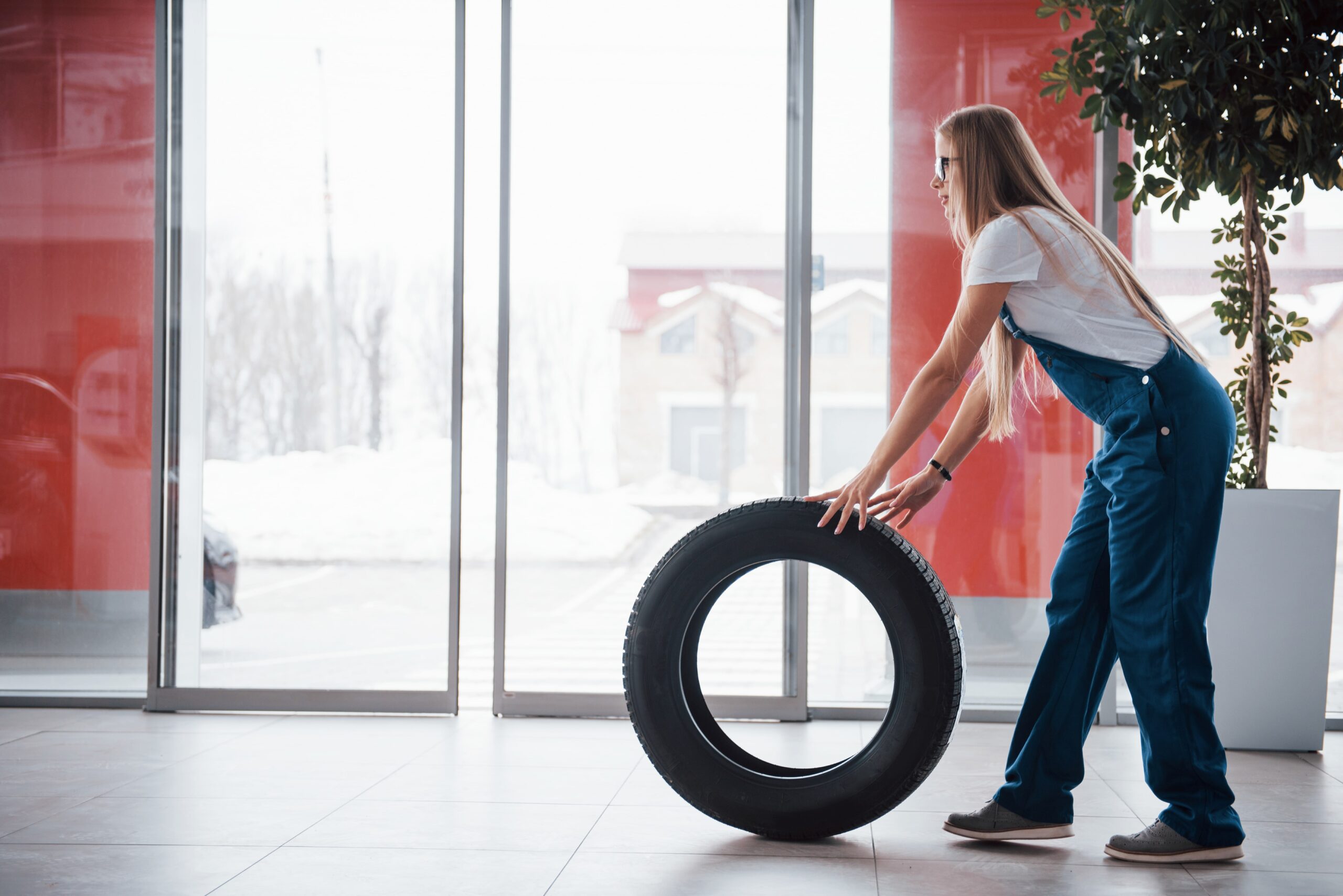 doors-is-opening-woman-walks-with-brand-new-wheel