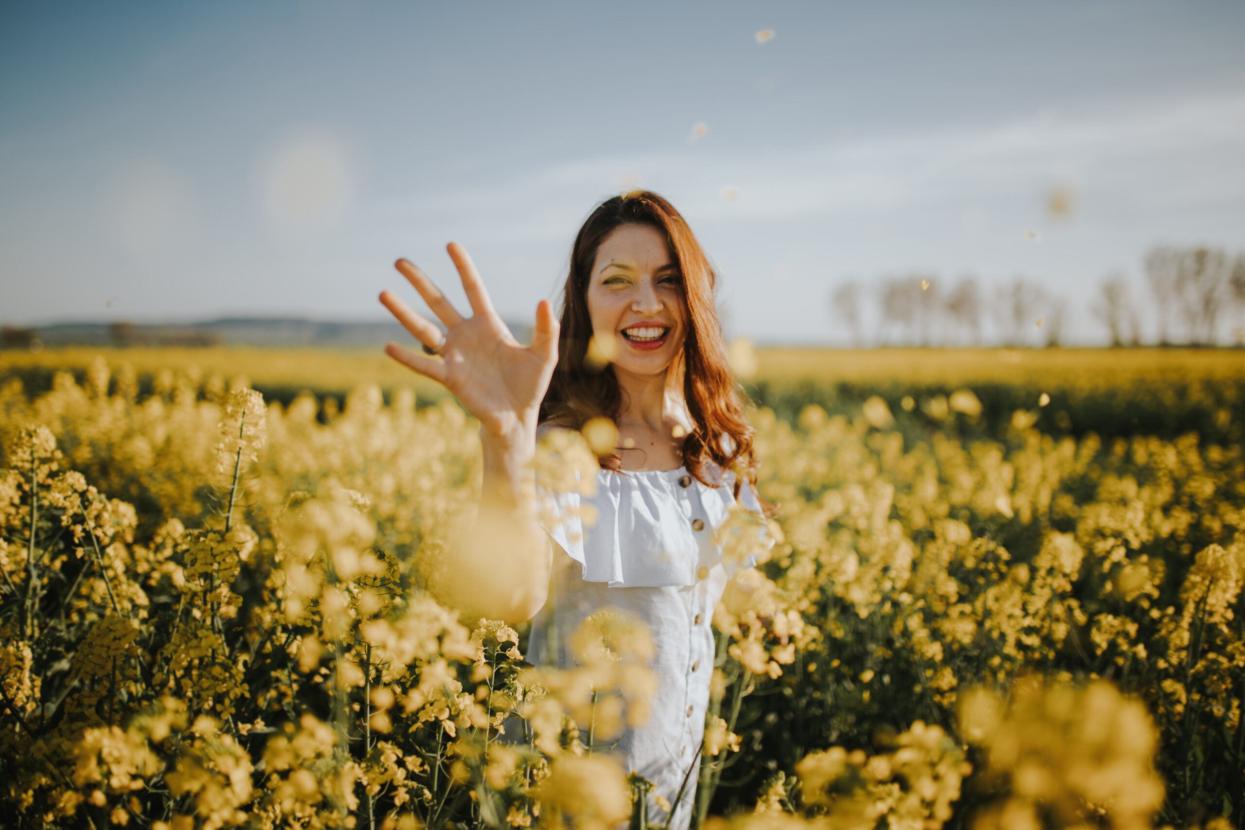 Woman with flowers in field